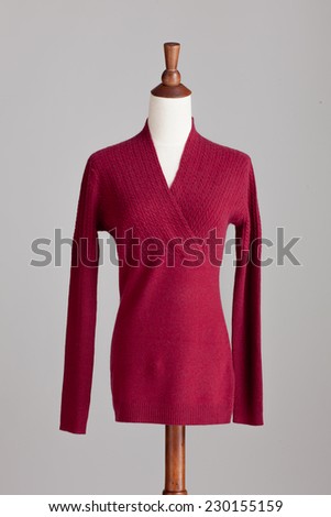 red woman cashmere sweater with wood model on grey isolated