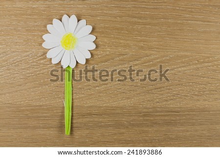 Flower from paper - Margarite paper prepared on the wood background