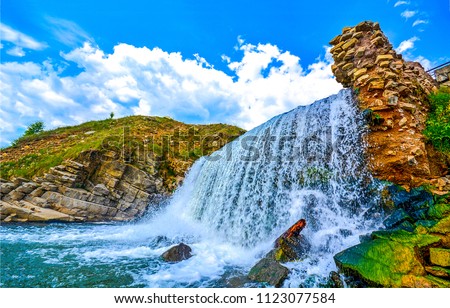Mountain waterfall landscape. Waterfall mountain view. Mountain waterfall scene