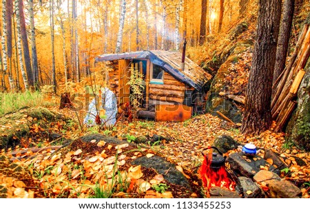 Autumn forest hunting hut landscape. Hunting hut in autumn forest. Forest hunting hut in autumn forest scene