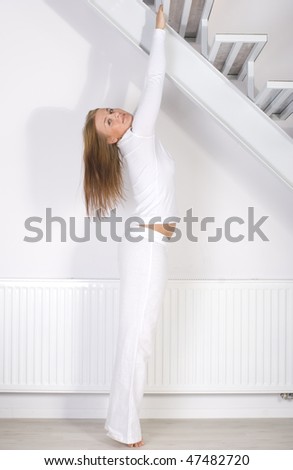 Young lady making fitness exercise at home