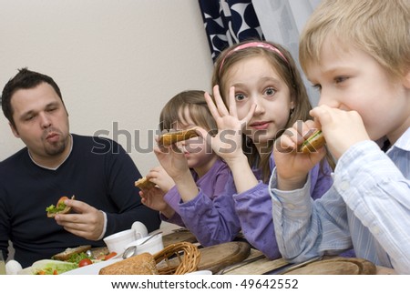 Happy family as they eat breakfast