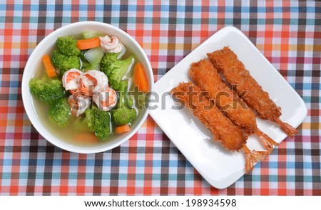 Broccoli, boiled and fried shrimp.