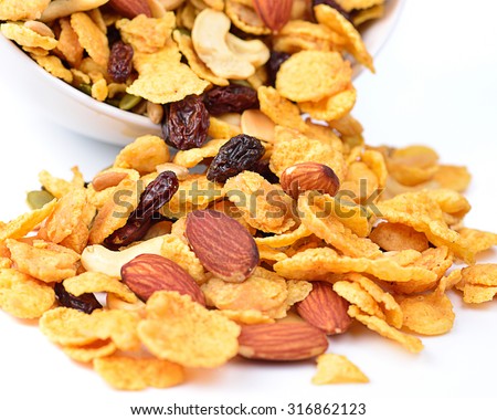 Healthy breakfast set with almonds raisins walnuts cereal