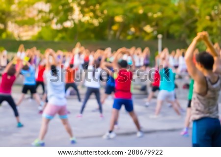 Blur background group man and women  dancing a fitness dance or aerobics in an old park