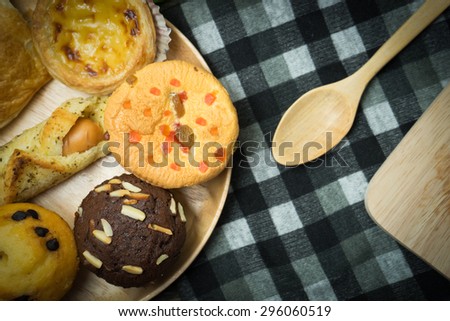 depth of field of Bakery food place one wood dish wood spoon and green leaves on the old wood table concept  the fat that comes from food
