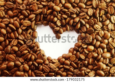 a lot of coffee beans and heart in the center