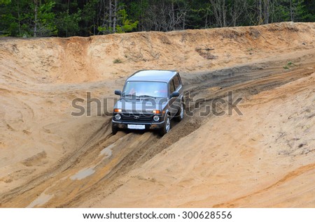 MINSK, BELARUS - CIRCA APRIL 2015: LADA 4x4 Urban drives along the road during the test drive event for automotive journalists from Minsk