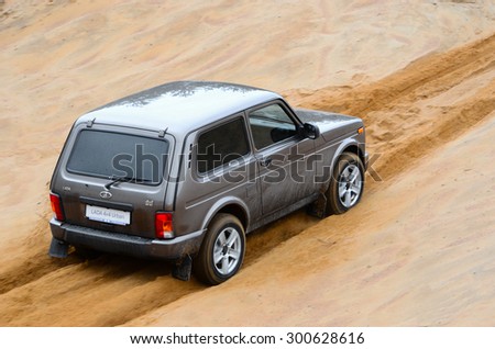 MINSK, BELARUS - CIRCA APRIL 2015: LADA 4x4 Urban drives along the road during the test drive event for automotive journalists from Minsk