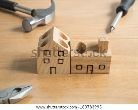 Set of tools and wood house toy.