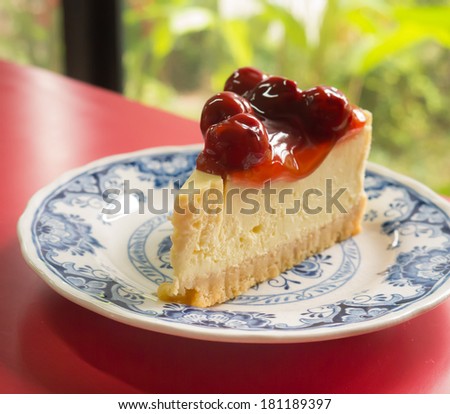 Cheesecake with Berries topping on a vintage plate