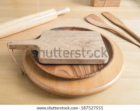 Chopping board and baking utensils on the wood table