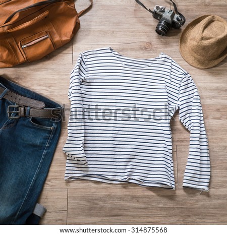 Top view of Vintage clothing and accessories on the wooden background