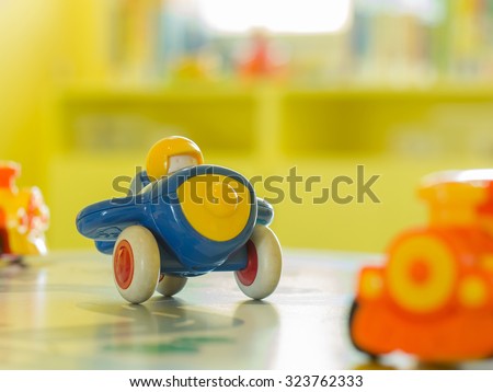 children toys - Blue plastic toy airplane and another toy on a table