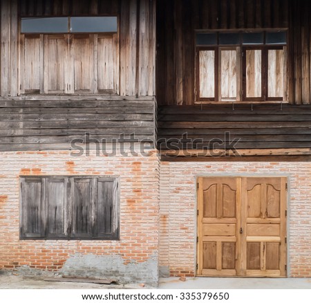 Vintage house of Brick wall and wooden wall with wooden window and door texture background