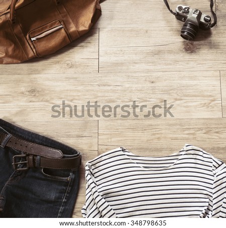 Top view of Vintage clothing and accessories on the wooden background ( Composition and space for text )
