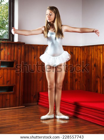 Young ballerina practicing in a dance studio