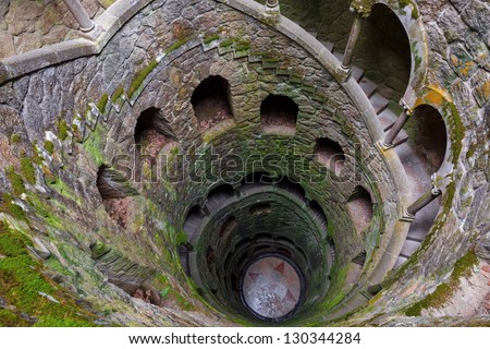 The Initiation well of Quinta da Regaleira in Sintra, Portugal. It\'s a 27 meter staircase that leads straight down underground and connects with other tunnels via underground walkways.