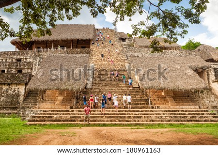 EK BALAM, MEXICO - JUNE 24 - Tourist climbing to The Acropolis on June 24, 2013. The Acropolis is the biggest building in the Mayan archeological site of Ek Balam (black jaguar) in Yucatan, Mexico