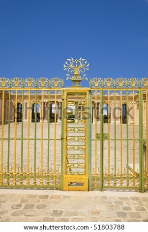 Golden door at entrance of Le Grand Trianon. Versailles Chateau. France