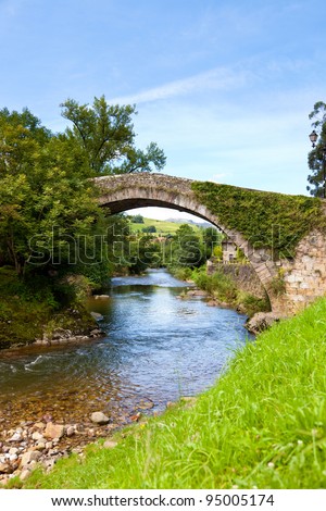 Old bridge over Miera river in Lierganes town. Cantabria, Spain