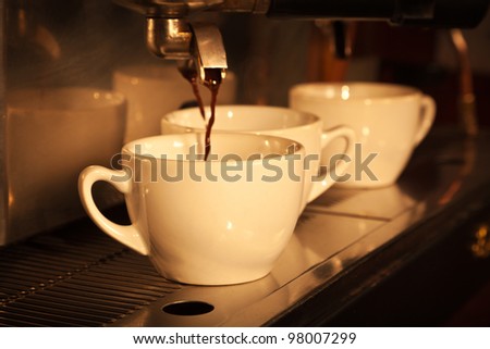 Espresso being drawn out of a professional espresso machine. Vintage look