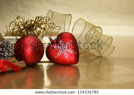 Christmas background with a heart shaped bauble