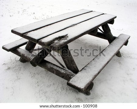 Park Bench - Winter. A snow-covered park bench.
