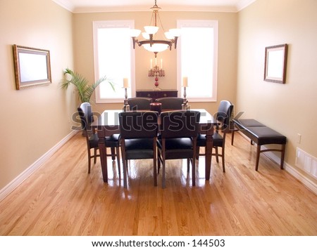 Spacious Dining Room has dark wood table, six chairs, chandelier, windows, natural wood floor