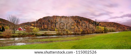 A Panoramic View Of Pasture Lands, A Small River And The Mountains Of Central New York State On A Rainy And Overcast Evening During The Peak Of Autumn, USA