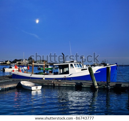 With A Half Moon On The Rise A Lobster Boat And Dinghy Sit At Rest In Waning Twilight, Rye Harbor, New Hampshire, USA