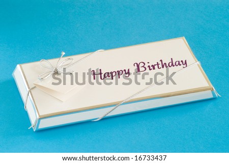 Happy birthday gift isolated against light blue background