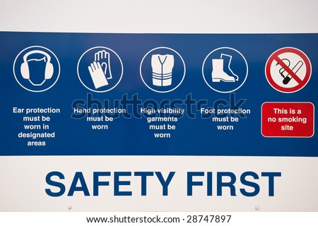 Detail of safetey first sign in a factory including several different hazards
