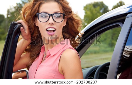 successful young woman in the car