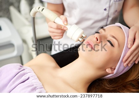 woman face treatment in medical spa center