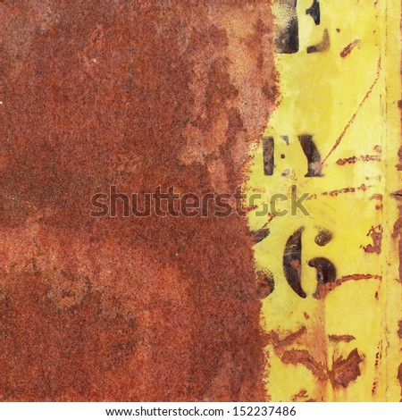 An Old Rusty Metal Background with Yellow Paint and Numbers, Letters