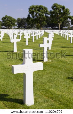 MARGRATEN - AUGUST 10: Crosses mark the graves of the more than 8000 soldiers whose remains have been buried at the American War Cemetery of Margraten in the Netherlands, on August 10, 2012.