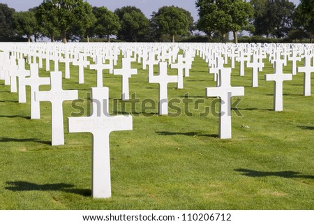 MARGRATEN - AUGUST 10: Crosses mark the graves of the more than 8000 soldiers whose remains have been buried at the American War Cemetery of Margraten in the Netherlands, on August 10, 2012.
