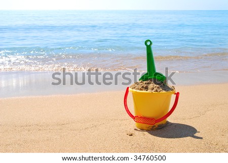 Shovel and bucket at the seashore