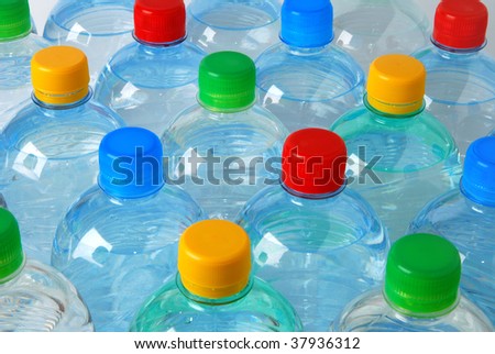Plastic bottles with caps in four colors