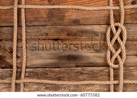 Rope frame on wooden background