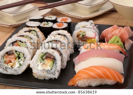 Set of sushi served on black plate