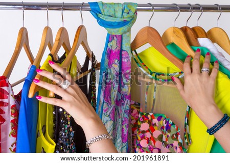 Cleaning and organizing the wardrobe of colorful style clothes