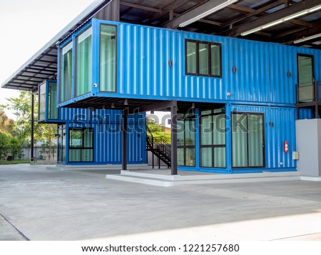 Modern blue cutting-edge shipping container construction office building.