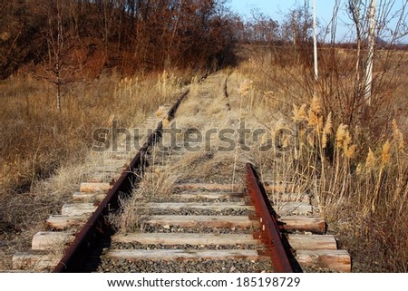 Old rusty abandoned rails and sleepers