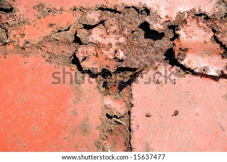 An image of some rusty metal up close that has been ripped up