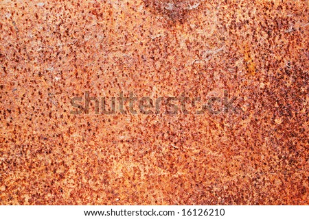 An image of some rusty metal up close that has been ripped up.
