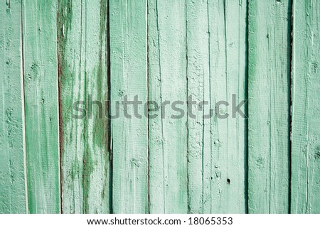 The wooden protection old on all background, is painted by a green paint