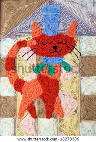 The cat a picture from a fabric a wool, is pasted on plywood.