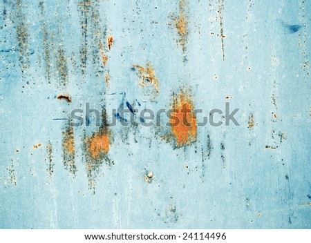 Plate of the metal rusty on all background, with old layer of the blue paint